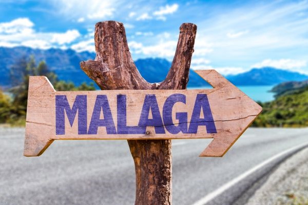Rustic signpost to Malaga, Costa del Sol